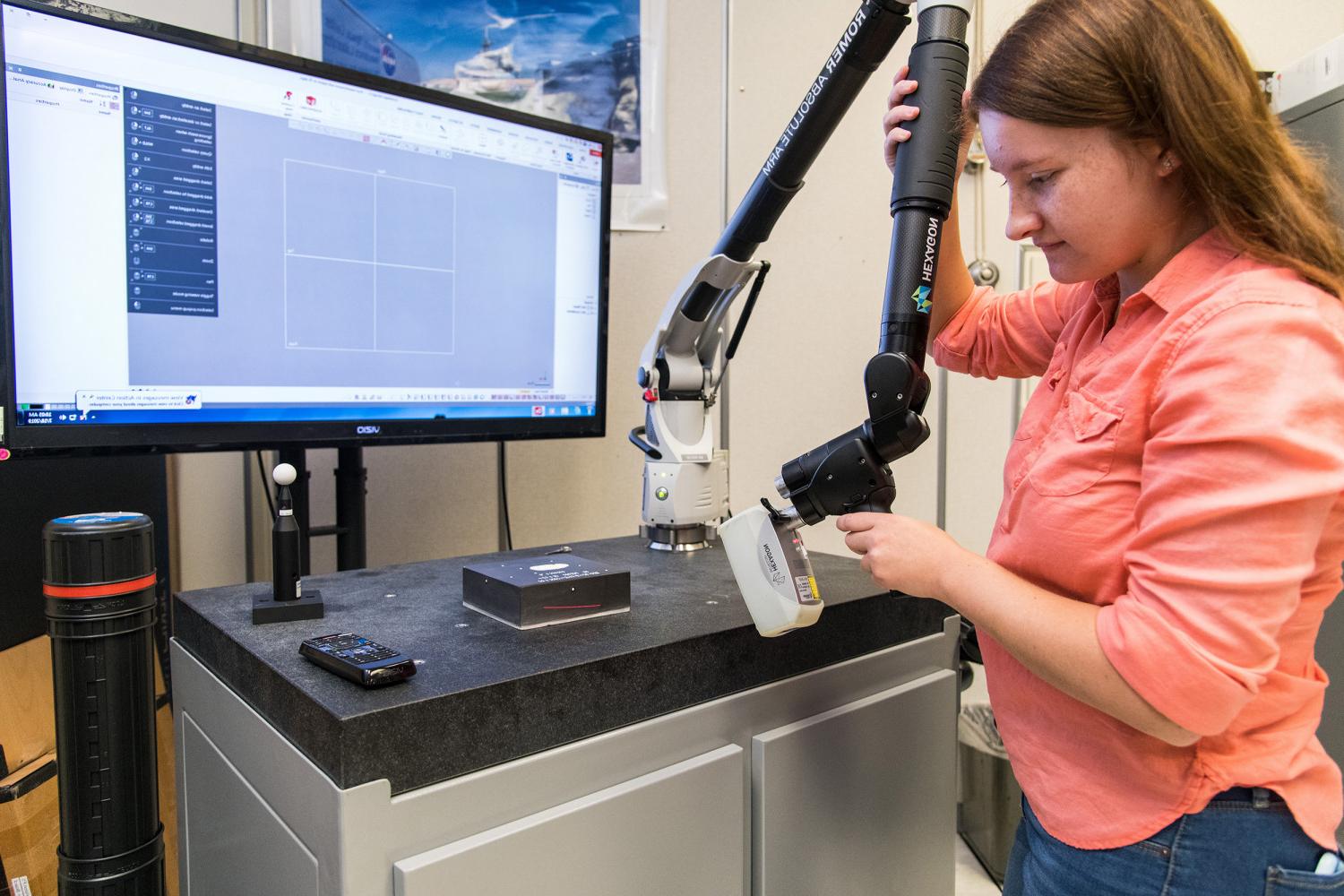 Carthage alumna, Megan Janiak, working at NASA's Kennedy Space Center during her internship.